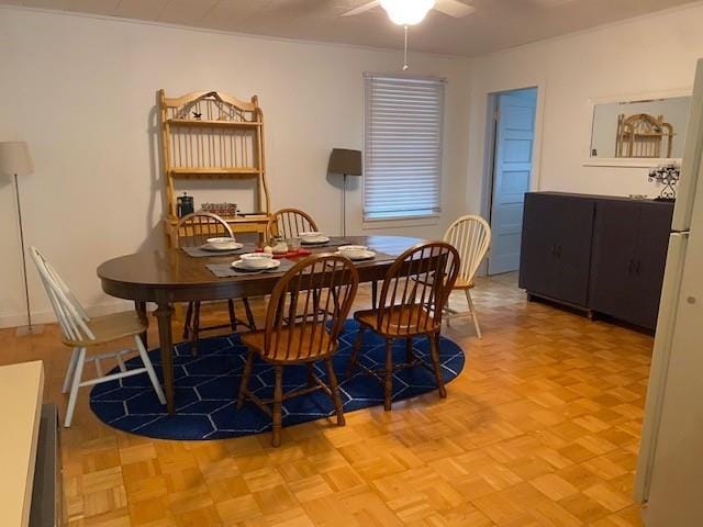 dining area featuring a ceiling fan