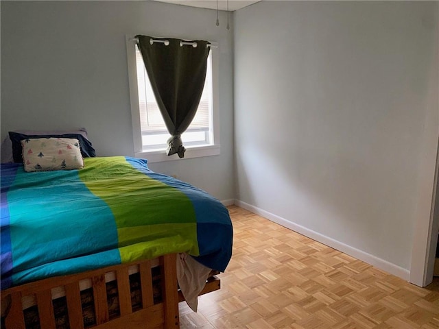 bedroom featuring baseboards