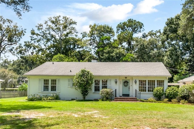 ranch-style home featuring a front yard