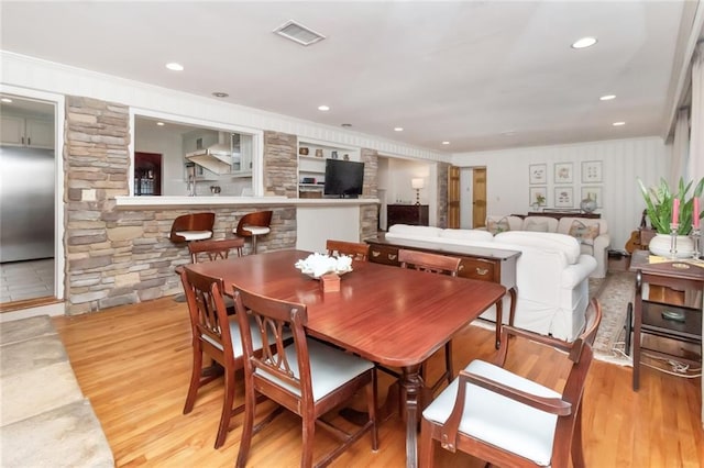 dining room with light wood-type flooring