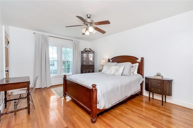 bedroom featuring ceiling fan and light hardwood / wood-style flooring