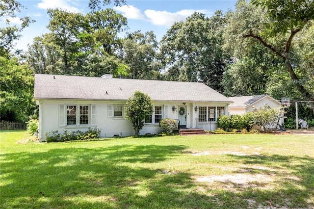 ranch-style home featuring a front yard