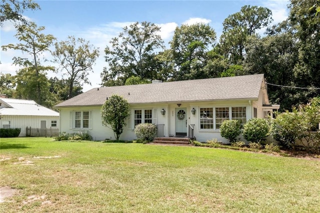 ranch-style home with a front yard