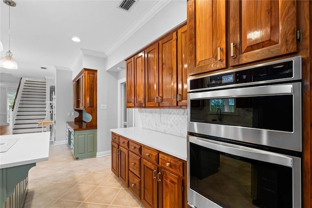 kitchen with backsplash, pendant lighting, light tile patterned flooring, ornamental molding, and stainless steel double oven