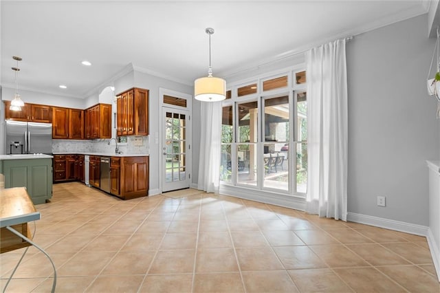 kitchen with light tile patterned flooring, appliances with stainless steel finishes, tasteful backsplash, and decorative light fixtures