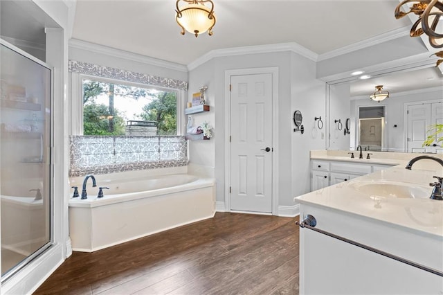 bathroom with wood-type flooring, vanity, crown molding, and plus walk in shower