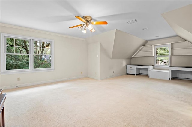 bonus room with ceiling fan, light carpet, and vaulted ceiling