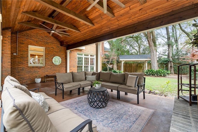 view of patio / terrace with ceiling fan and an outdoor living space