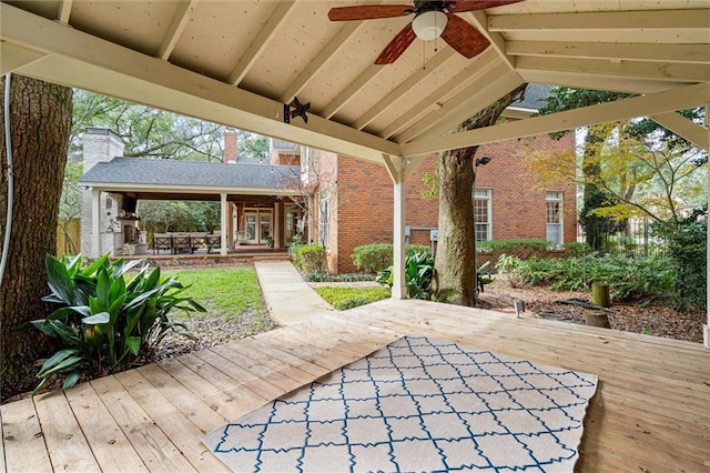 view of patio / terrace featuring ceiling fan, a deck, and a gazebo