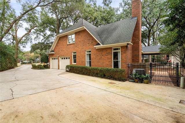 view of property exterior with a garage