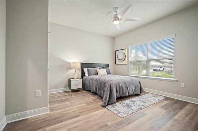 bedroom featuring light hardwood / wood-style flooring and ceiling fan