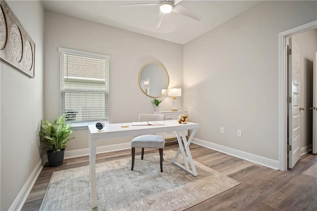 office with wood-type flooring and ceiling fan