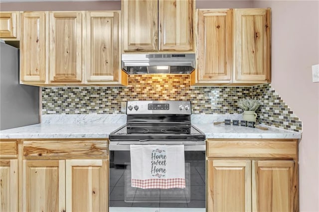 kitchen featuring stainless steel electric range, light brown cabinets, and under cabinet range hood