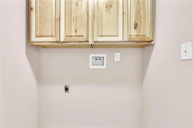 laundry area with hookup for an electric dryer, cabinet space, and washer hookup