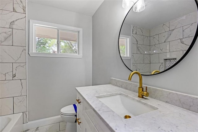 full bathroom featuring tiled shower / bath, toilet, tile floors, and vanity with extensive cabinet space