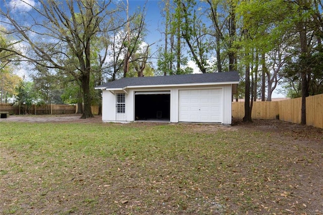 garage with a yard