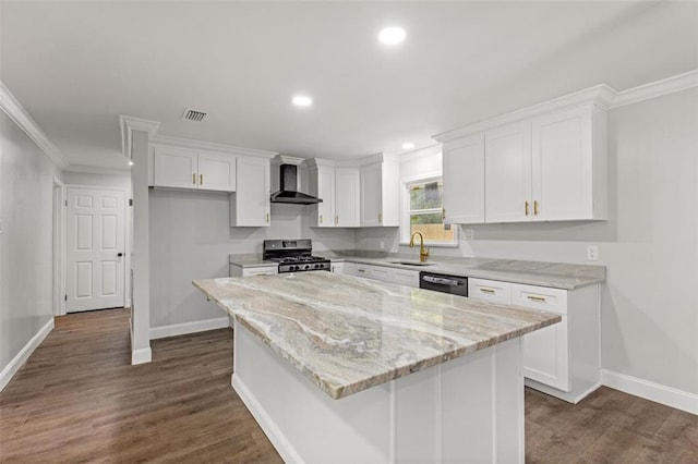 kitchen featuring a kitchen island, dark wood-type flooring, ornamental molding, and wall chimney exhaust hood