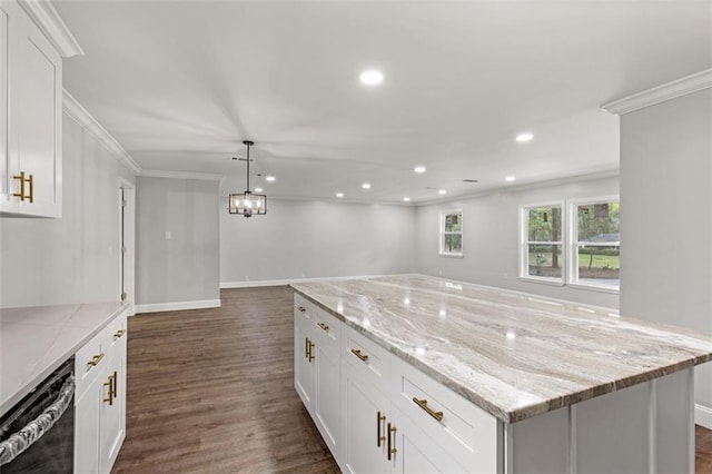 kitchen featuring hanging light fixtures, dark wood-type flooring, a center island, light stone countertops, and white cabinets