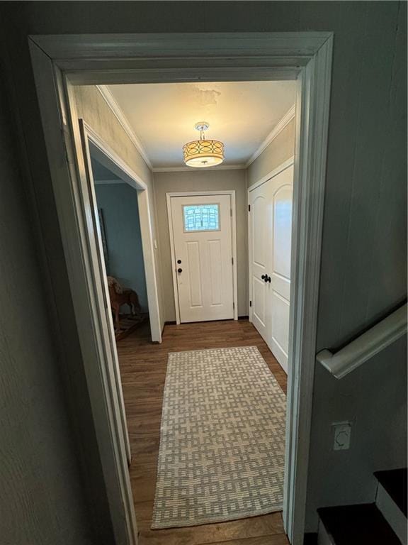 entryway with crown molding and hardwood / wood-style floors