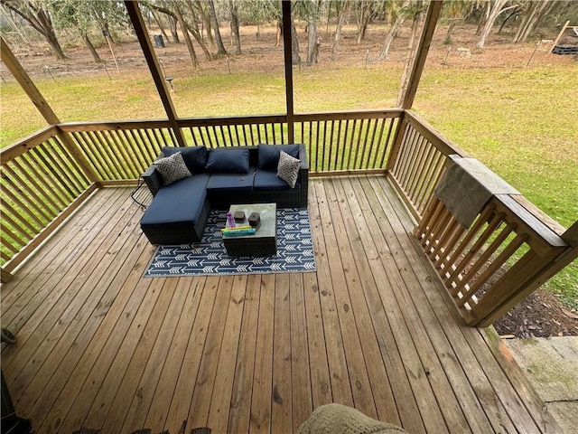 wooden terrace with outdoor lounge area and a yard