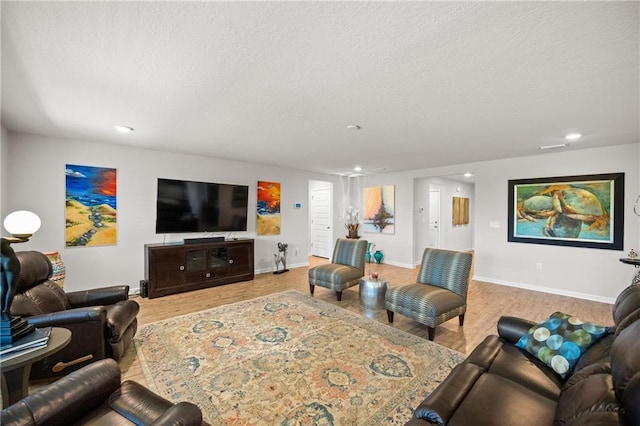 8320 Ogilvy Ct, Daphne, AL 36526 - living room featuring baseboards, recessed lighting, a textured ceiling, and wood finished floors