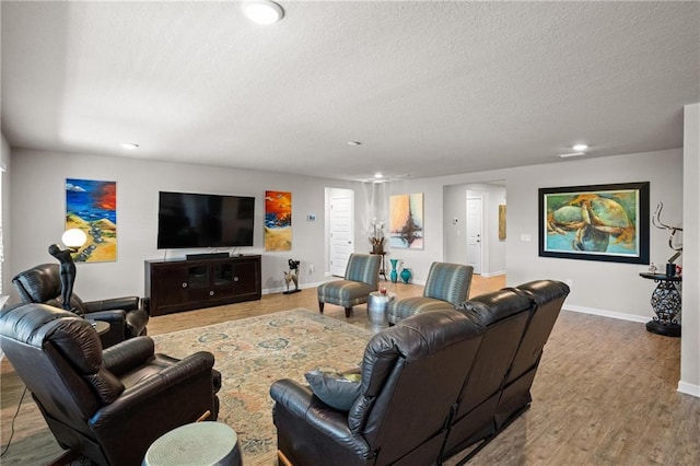 8320 Ogilvy Ct, Daphne, AL 36526 - living area with baseboards, a textured ceiling, recessed lighting, and wood finished floors