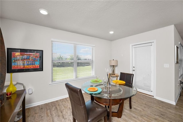 8320 Ogilvy Ct, Daphne, AL 36526 - dining space with a textured ceiling, baseboards, recessed lighting, and wood finished floors