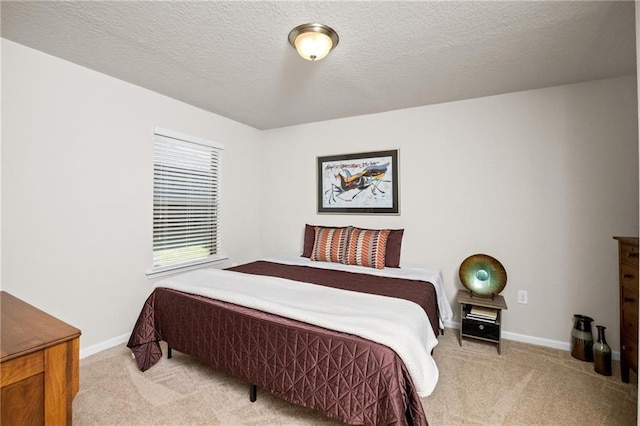 8320 Ogilvy Ct, Daphne, AL 36526 - bedroom with baseboards, a textured ceiling, and light colored carpet