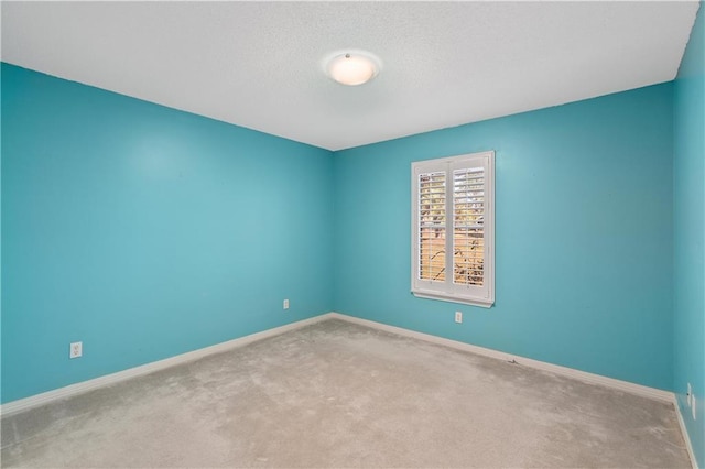 unfurnished room featuring carpet