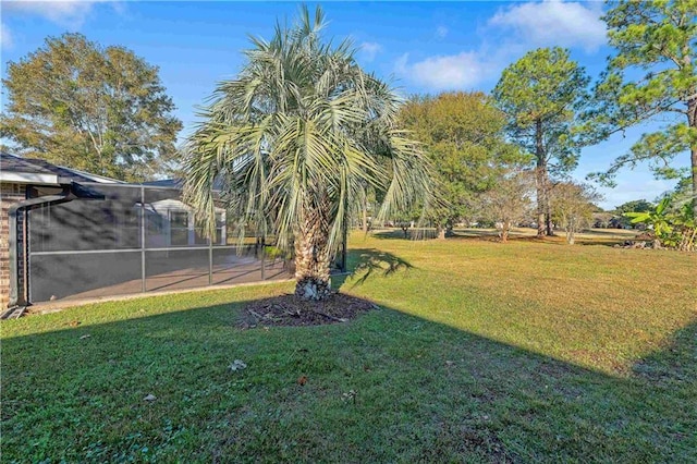 view of yard featuring a lanai