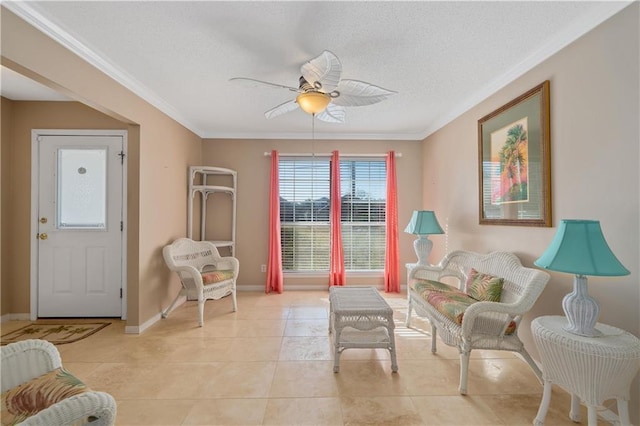 sitting room featuring light tile patterned floors, ceiling fan, and crown molding