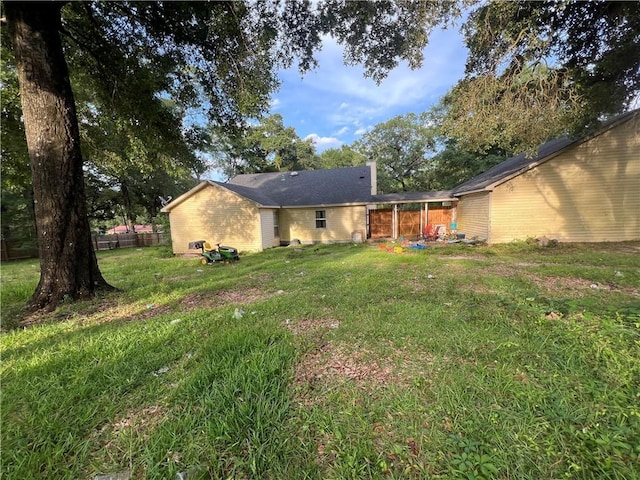 5470 Robert Jefferson Dr E, Theodore, AL 36582 - rear view of property with a chimney