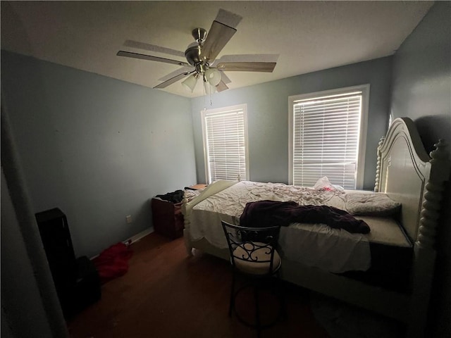 5470 Robert Jefferson Dr E, Theodore, AL 36582 - bedroom with wood finished floors, a ceiling fan, and baseboards