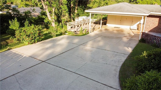 view of patio / terrace featuring driveway and a carport