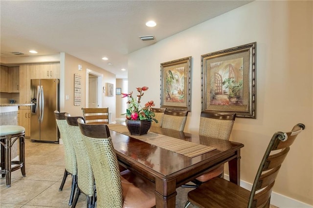 dining room featuring recessed lighting, visible vents, baseboards, and light tile patterned flooring