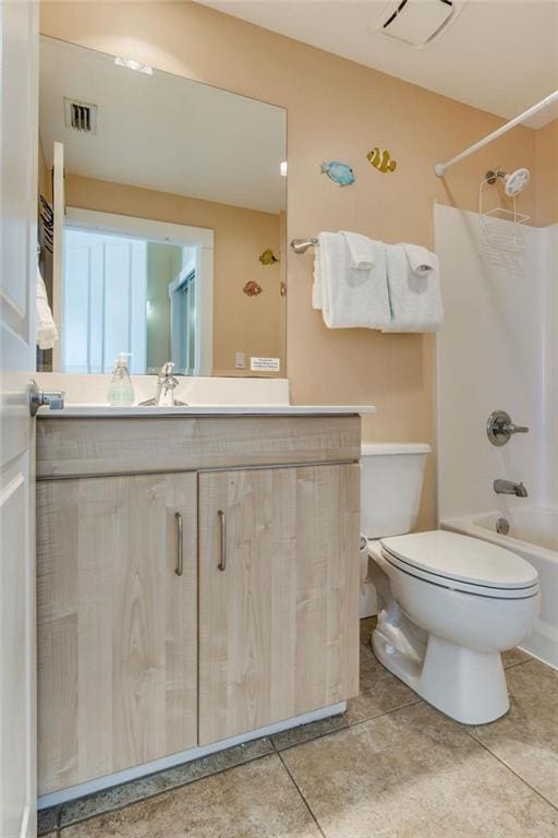 bathroom featuring visible vents, bathing tub / shower combination, toilet, tile patterned floors, and vanity