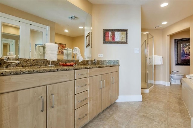 bathroom featuring double vanity, a stall shower, visible vents, and recessed lighting