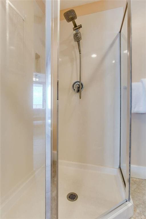 full bathroom featuring a stall shower