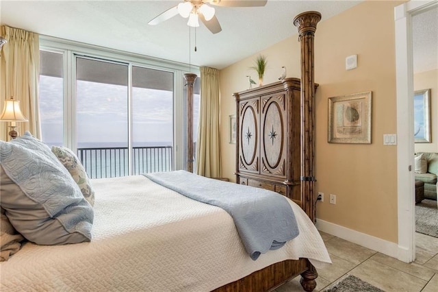 bedroom featuring access to outside, ceiling fan, baseboards, and light tile patterned floors