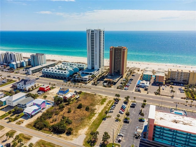 aerial view featuring a water view, a view of city, and a view of the beach