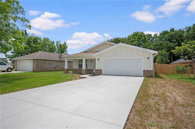 17126 Sugar Loop, Foley, AL 36535 - ranch-style home with a garage, board and batten siding, concrete driveway, and brick siding