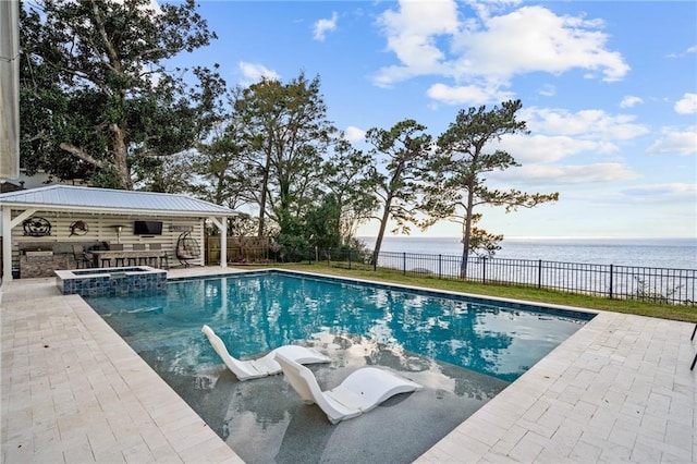 view of pool with a patio area, a gazebo, and a water view