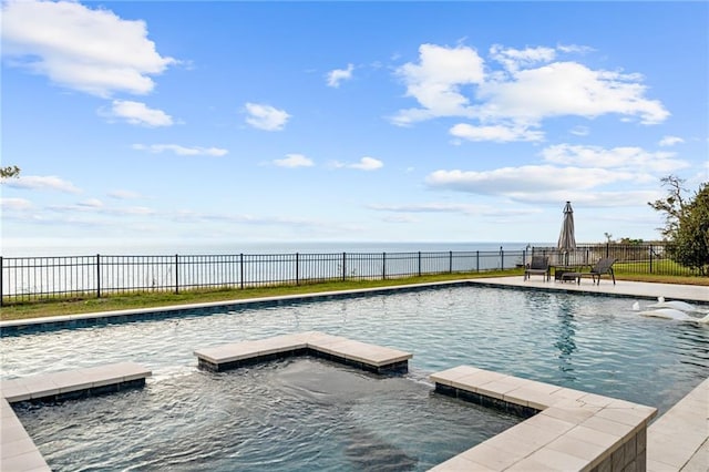 view of swimming pool featuring a water view