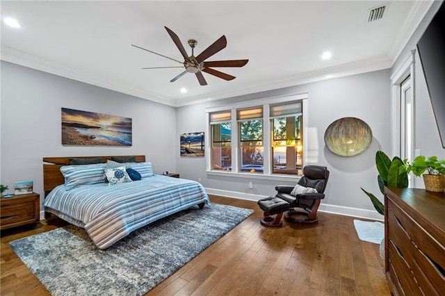 bedroom with crown molding, ceiling fan, and wood-type flooring