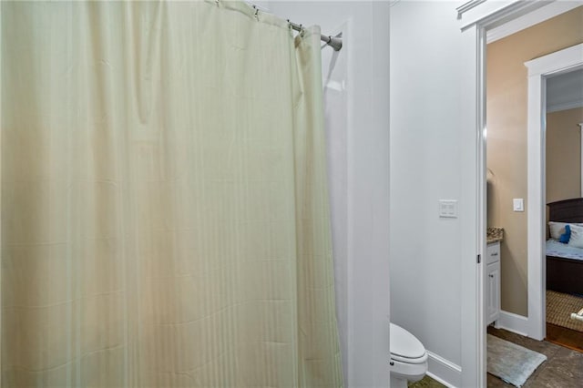 bathroom with vanity, toilet, and a shower with curtain