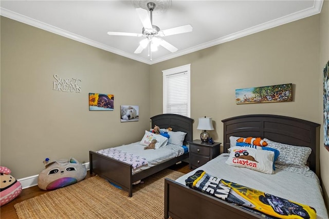 bedroom featuring ornamental molding, ceiling fan, and light hardwood / wood-style floors