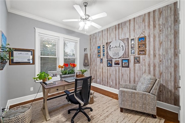 office featuring ceiling fan, crown molding, and light hardwood / wood-style flooring