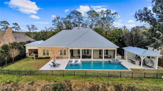 back of house with a lawn, a fenced in pool, and a patio area