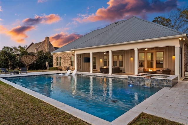 view of swimming pool featuring a yard, outdoor lounge area, and a patio