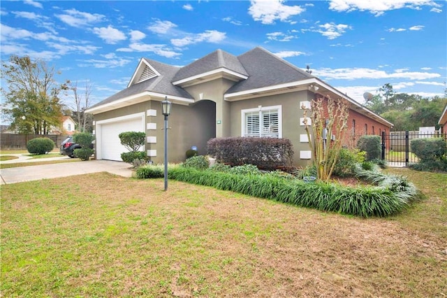 view of front facade with a garage and a front lawn